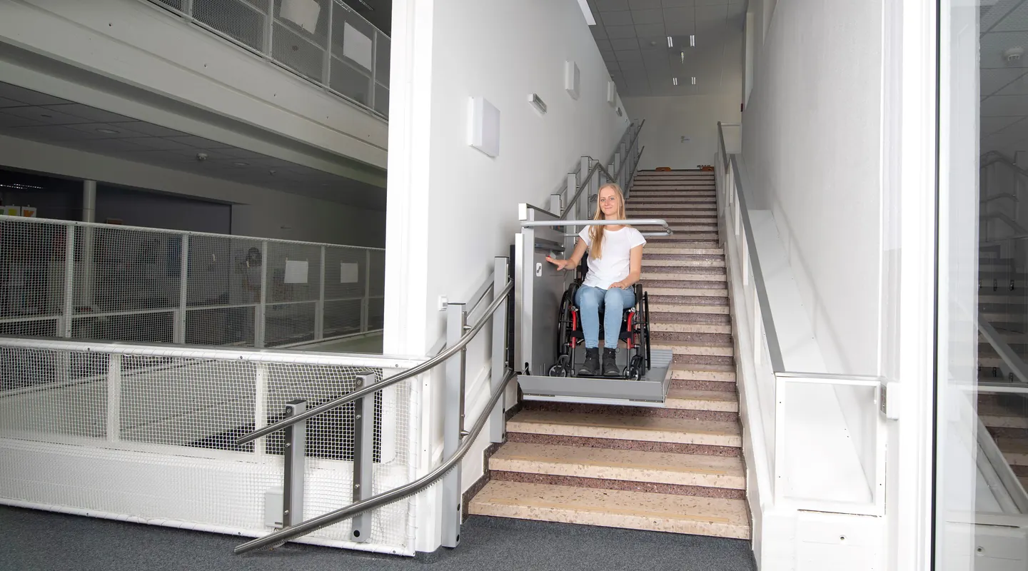 Ascendor wheelchair platform stairlift on the stairs of a public building
