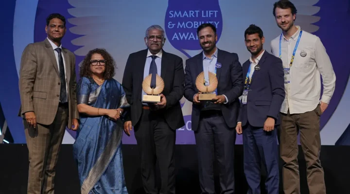 Team Mobility receiving the Smart Lift and Mobility Awards 2026 trophy on stage in Bengaluru