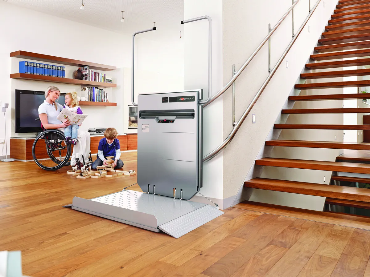 Ascendor wheelchair platform stairlift beside the stairs in a family home