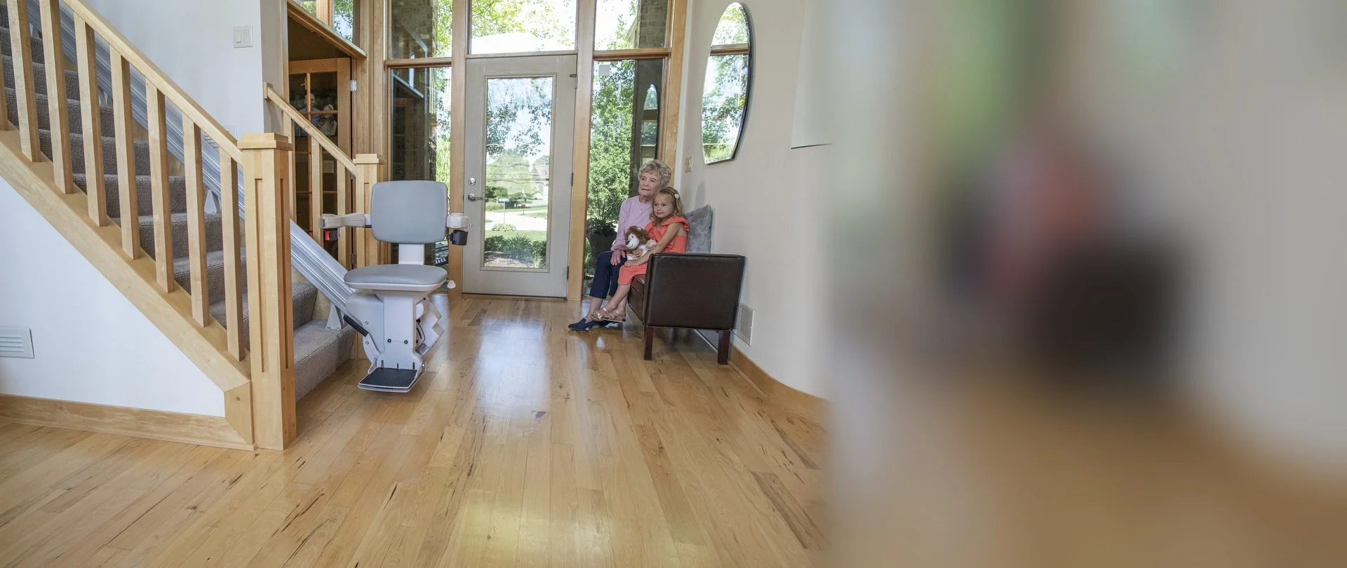 Stairlift on a straight staircase in a hallway